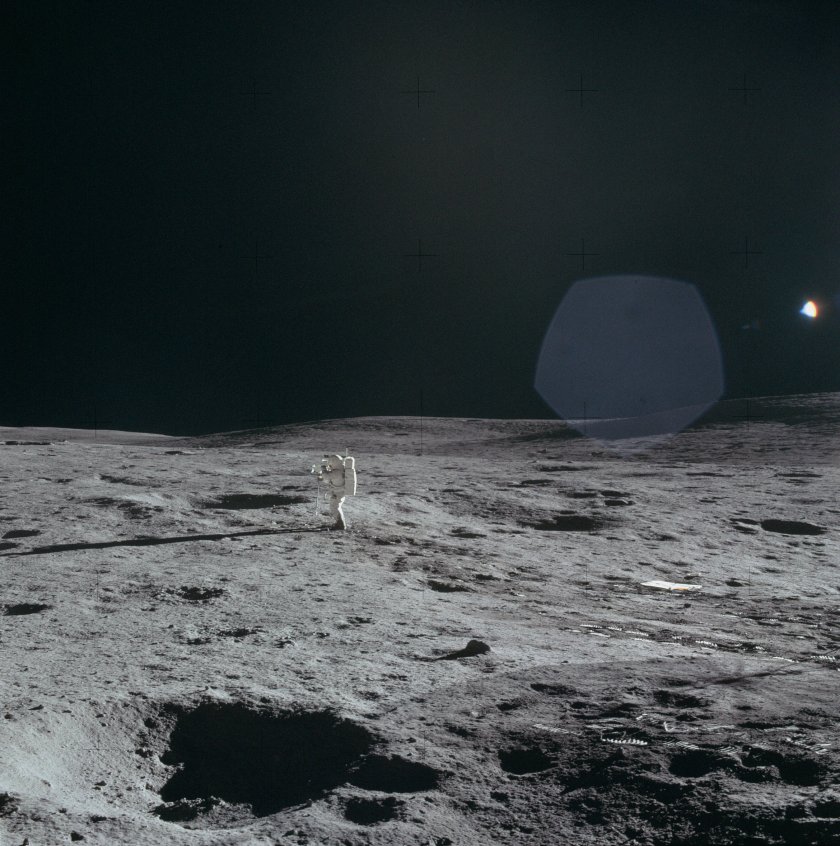 Ed_doing_a_TV_pan_and,_in_the_distance_considerable_detail_of_the_Cone_Crater_ridge NASA.jpg